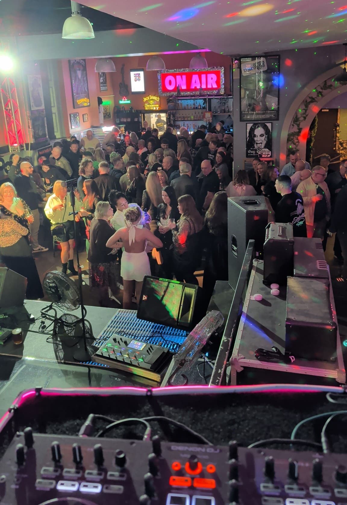 Vault 27 floor from above — ON AIR sign, full house